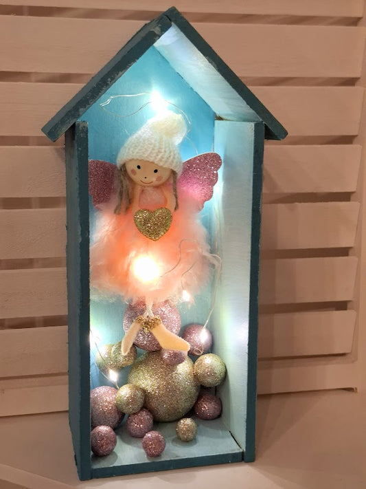 Wooden house with fairy lights.