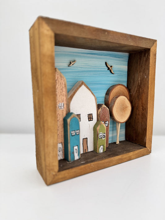 Handmade wooden frame with houses